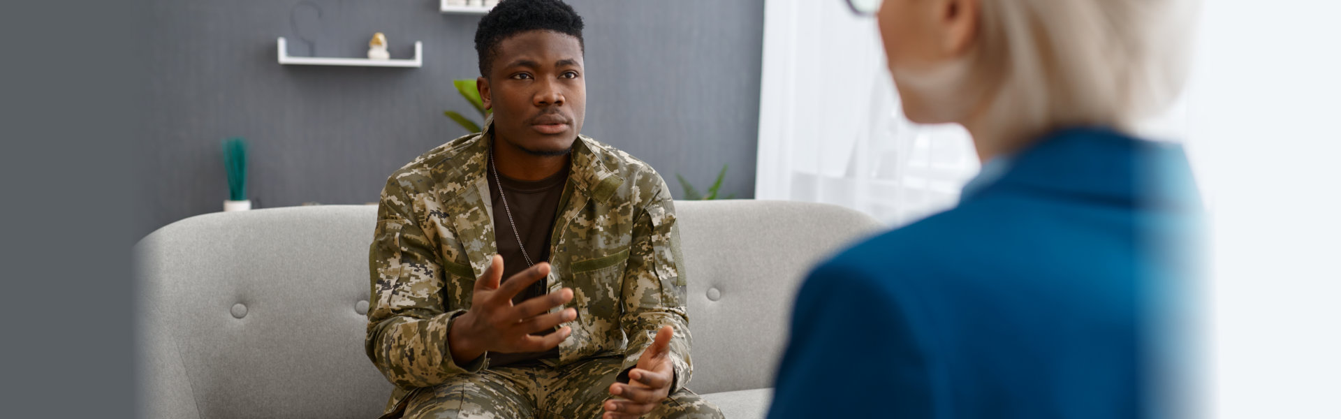 Professional psychologist giving advice to military patient
